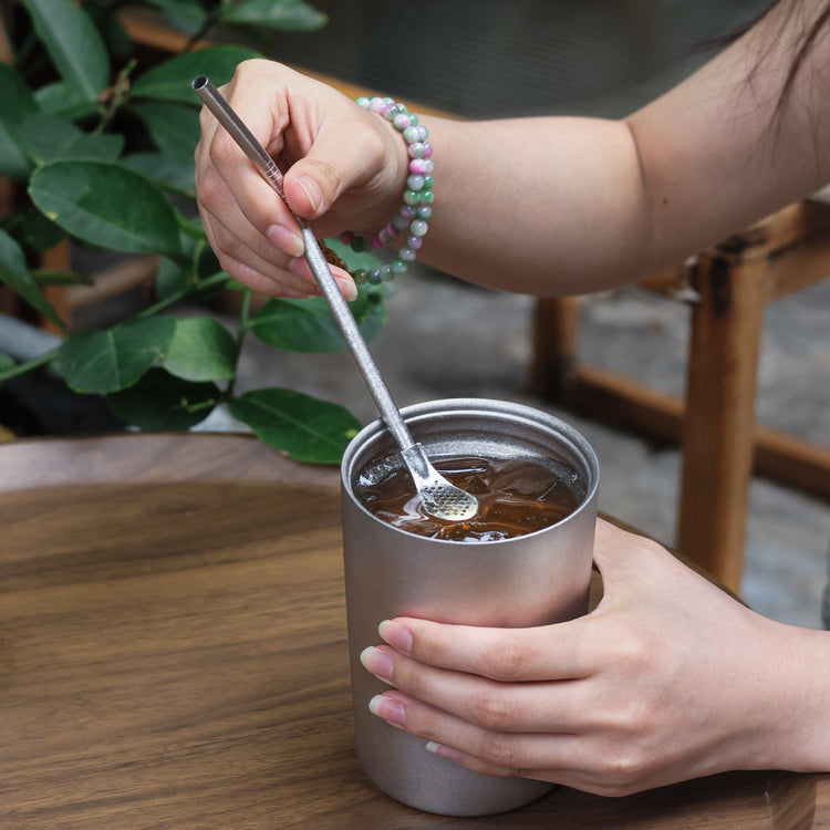 
                  
                    SilverAnt Ultralight Titanium Straw Crystallized with Strainer - Actual product photo, real life, in use, lifestyle shot, used in SilverAnt Titanium Cup to drink iced tea
                  
                
