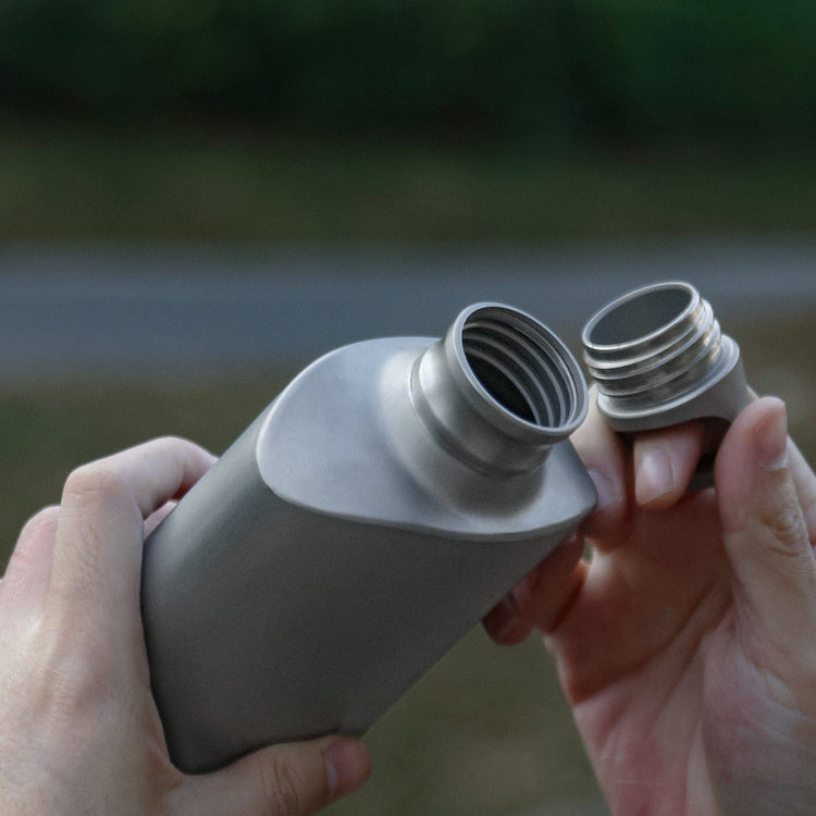 
                  
                    SilverAnt Ultralight Titanium Water Bottle 600ml/21 fl oz Slim - Sandblasted (Actual product photo, in-use, opened to reveal bottle mouth screw marks)
                  
                