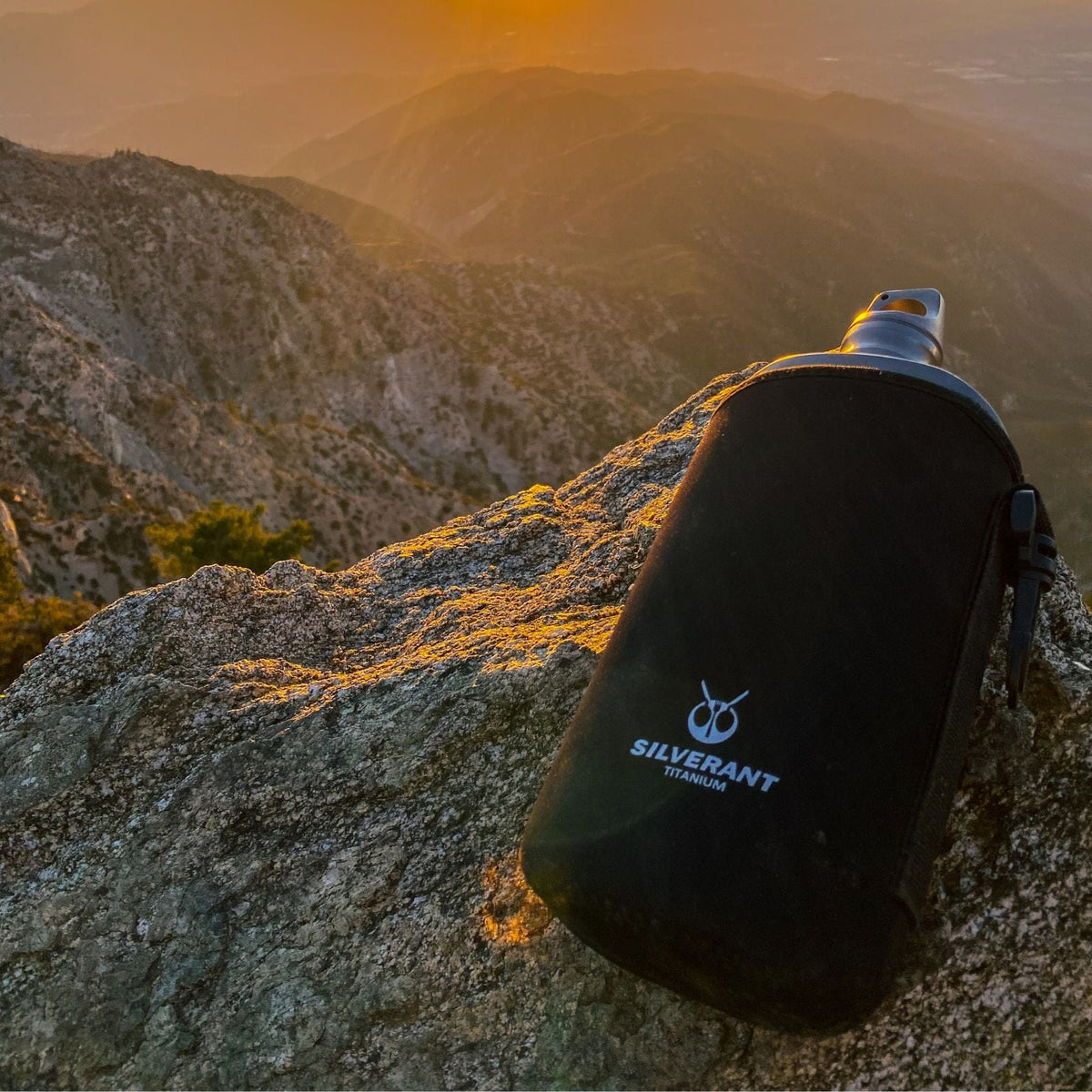 SilverAnt Ultralight Titanium Water Bottle 600ml/21 fl oz Slim - Sandblasted (Actual product photo, lifestyle shot, beautiful view in the background, black thermal sleeve)