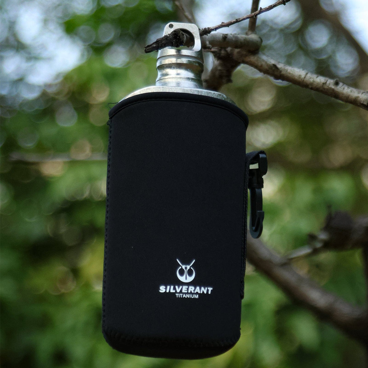 SilverAnt Ultralight Titanium Water Bottle 800ml/28.16 fl oz (Slim Crystallized) - In-use (lifestyle photo, actual product photo, hanging by a tree branch, thermal sleeve, silverant branding)