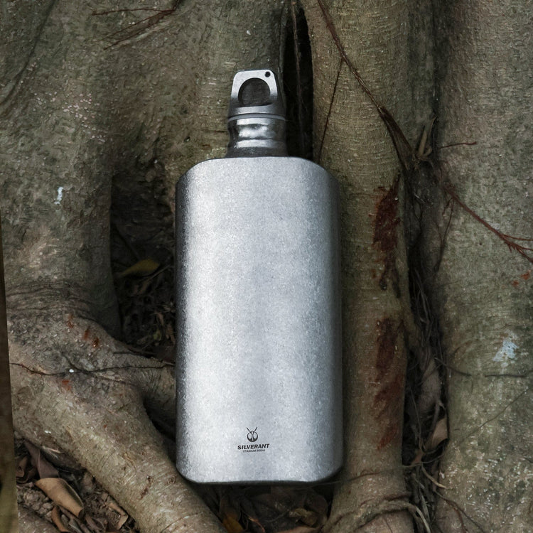
                  
                    SilverAnt Ultralight Titanium Water Bottle 800ml/28.16 fl oz (Slim Crystallized) - In-use (Actual product photo, placed down in tree roots, crystallized finish)
                  
                