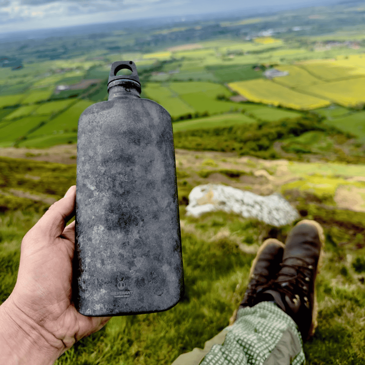 SilverAnt Ultralight Titanium Water Bottle 800ml/28.16 fl oz (Slim Crystallized Black) - In-Use (actual product photo, clear photo shows silverant branding, beautiful background)