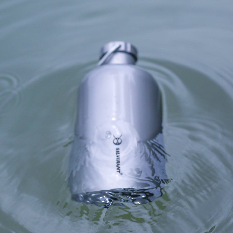 
                  
                    SilverAnt Ultralight Titanium Water Bottle Narrow Mouth Design - actual product photo, lifestyle shot, floating on water
                  
                
