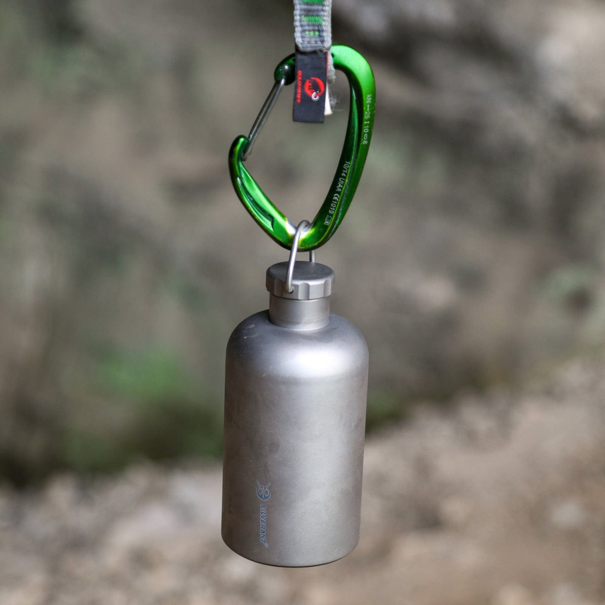 SilverAnt Ultralight Titanium Water Bottle Narrow Mouth Design - actual product photo, hooked to a carabiner, hanging in the air