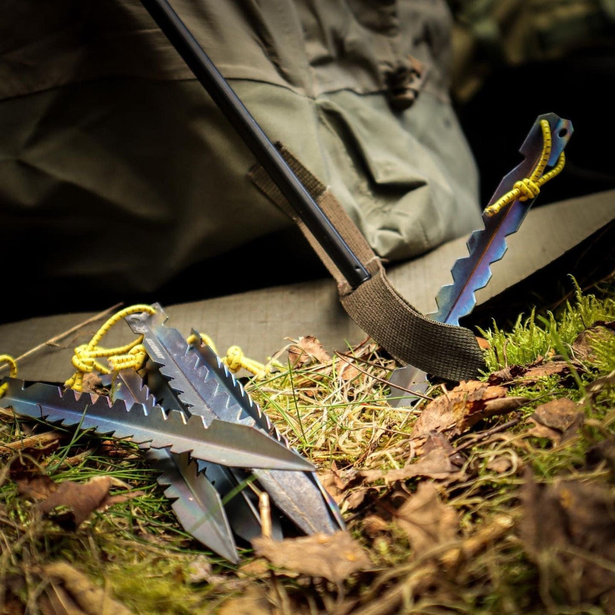 SilverAnt Ultralight Titanium Y-Shape Tent Stakes 6-Pack - Large (Close-up, actual product photo, propped up/set-up on grassy ground to secure tent)