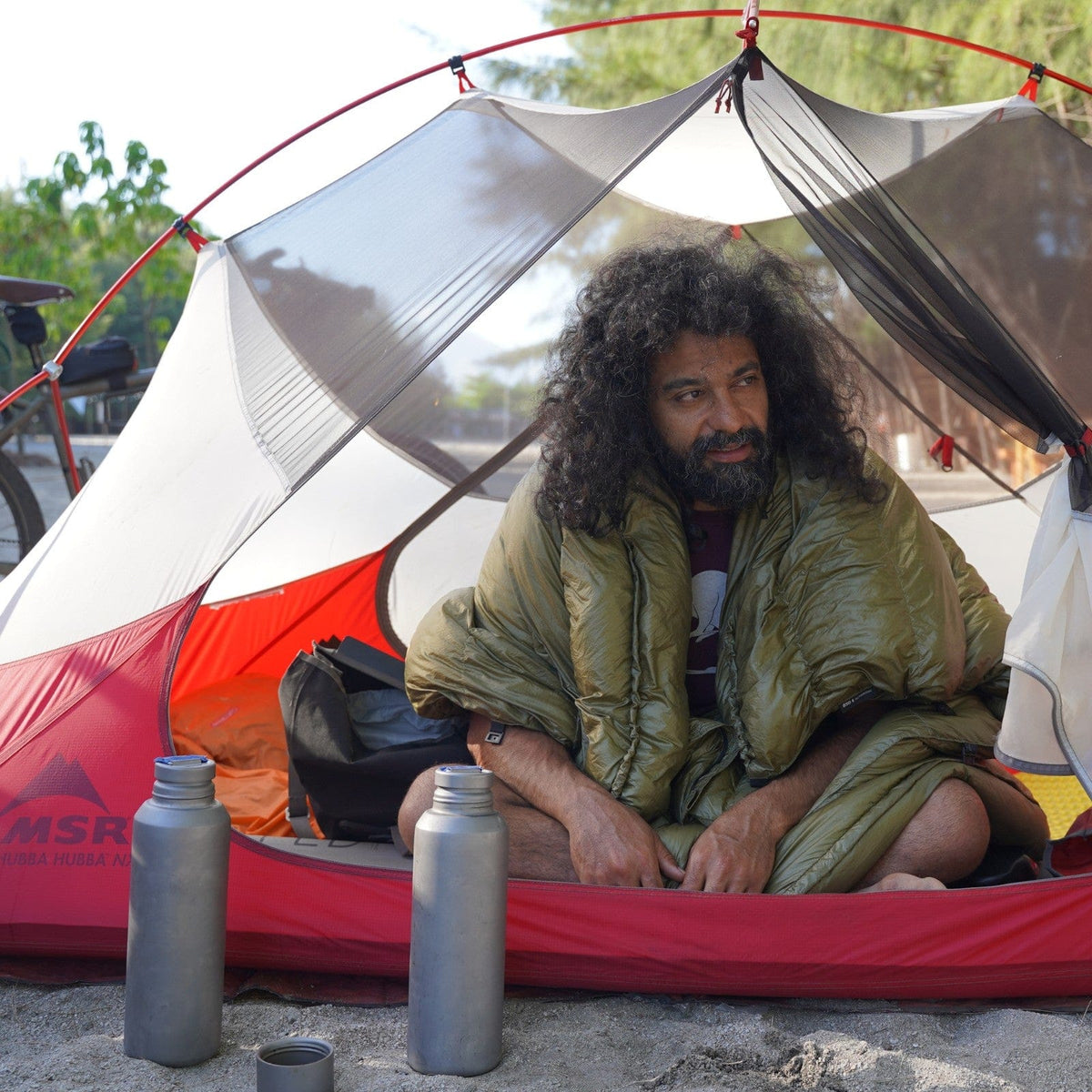 SilverAnt X 5Athlon Nomads Trails Collaboration - Peyman in tent with SilverAnt water bottles in foreground