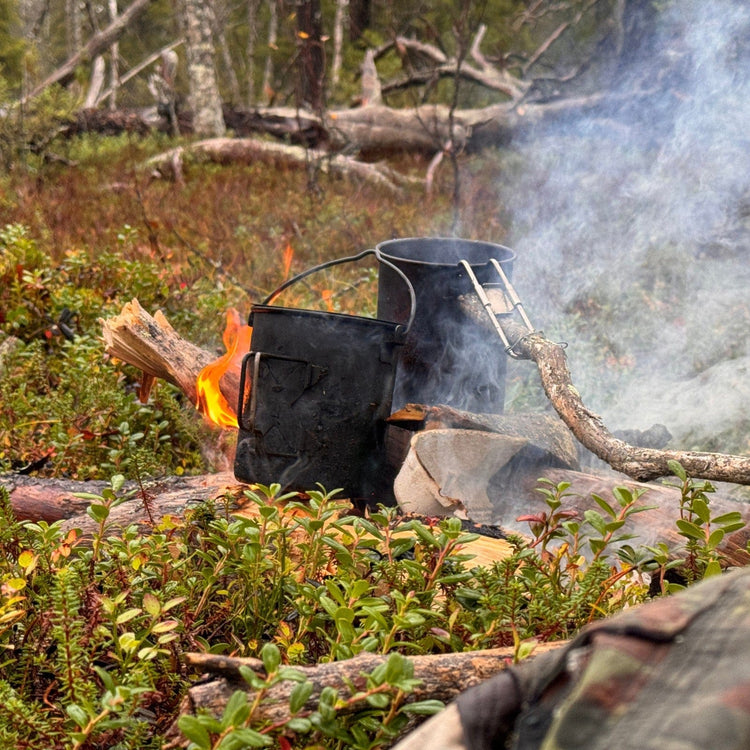 
                  
                    SilverAnt X 5Athlon Nomads Trails Collaboration - SilverAnt Titanium Cup and SilverAnt Titanium Pot placed on wood campfire
                  
                