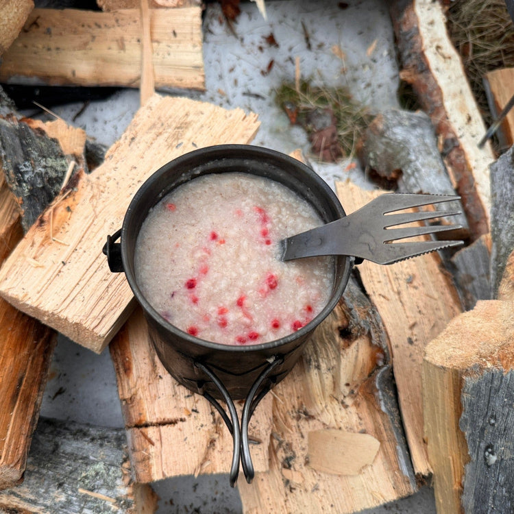 
                  
                    SilverAnt X 5Athlon Nomads Trails Collaboration - Actual photo of SilverAnt 3-in-1 Spoon, Fork, and Knife on a SilverAnt Titanium Cup, being used to eat oatmeal with berries
                  
                