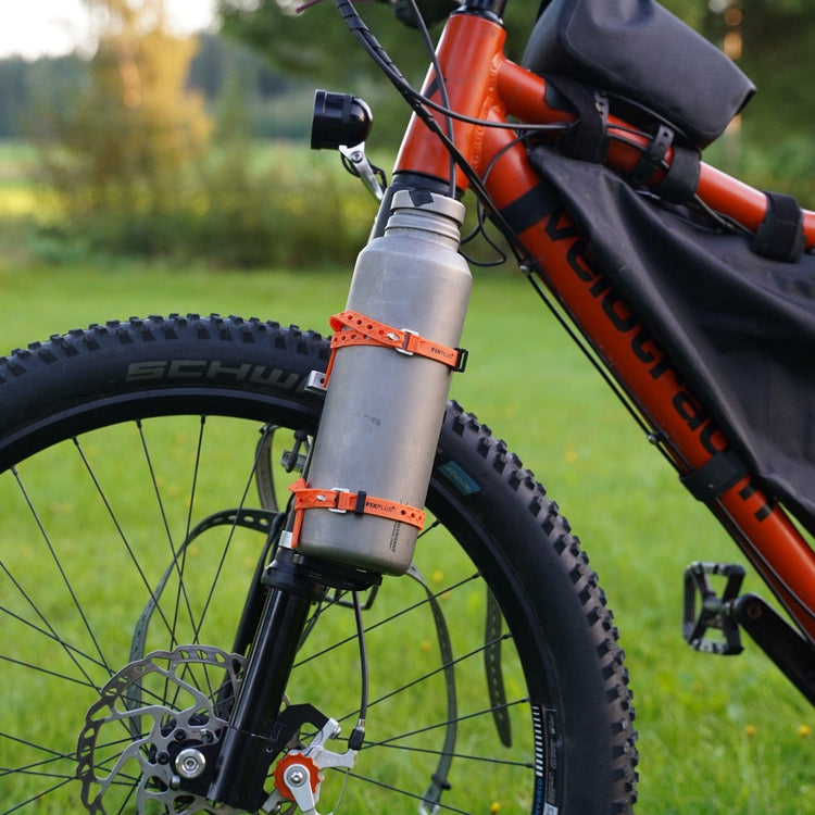 
                  
                    SilverAnt X 5Athlon Nomads Trails Collaboration - Close-up of Large Titanium Water Bottle with cup strapped on their bikepacking bicycle 
                  
                