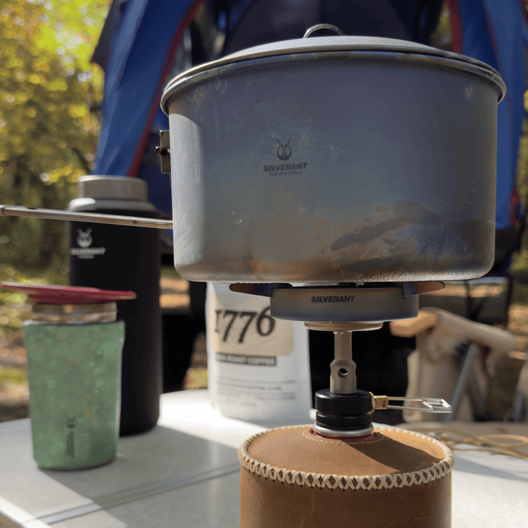 
                  
                    SilverTi Ultralight Titanium Gas Stove - Actual product photo, close-up, real life, with SilverAnt Titanium Cooking pot on top 
                  
                