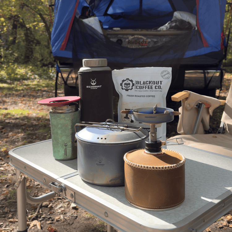 
                  
                    SilverTi Ultralight Titanium Gas Stove - Actual product photo, real life use, placed on table with other SilverAnt camp gear
                  
                