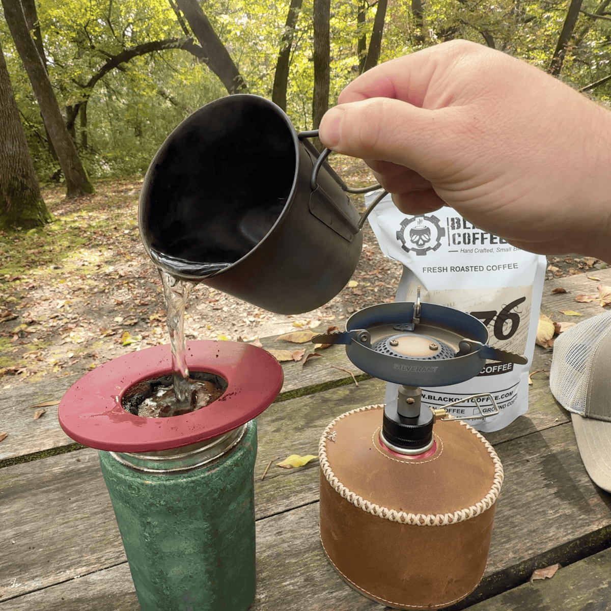 SilverTi Ultralight Titanium Gas Stove - Actual product photo, real life use, in use, placed on wooden table outdoors making coffee