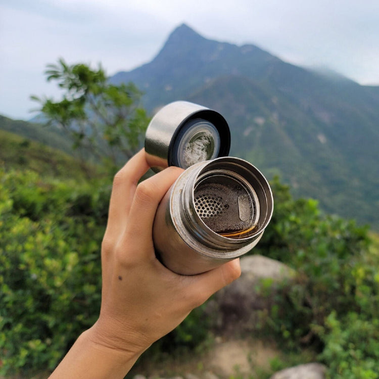
                  
                    Titanium Double-Wall Insulated Thermos Flask 400ml/14fl oz - actual product photo, crystallized finish, opened, showing the bottle's inside components)
                  
                