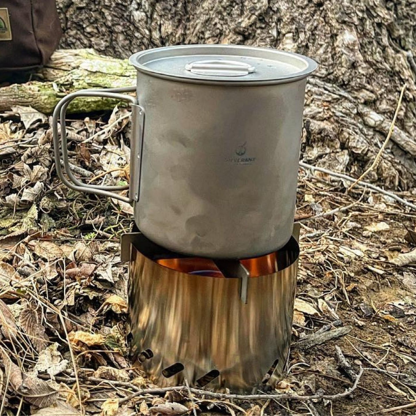 
                  
                    Ultralight Titanium Multi-Fuel Stove, Cross Stand & Windshield - boiling water in a titanium cup
                  
                
