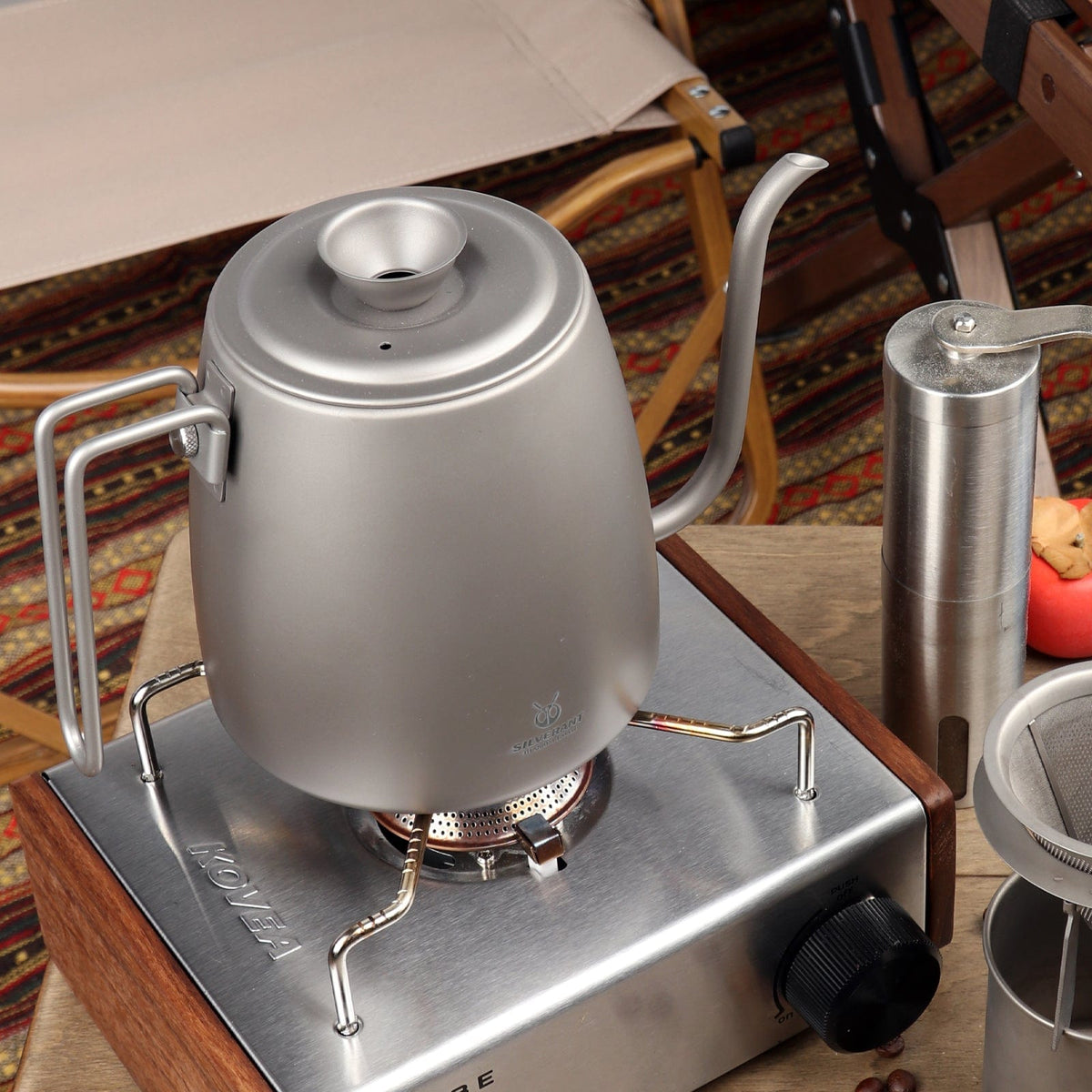 Titanium Pour-Over Kettle Sandblasted 1200ml/42.2 fl oz - Actual product photo, real life still, propped up/set-up on a gas stove, lifestyle shot