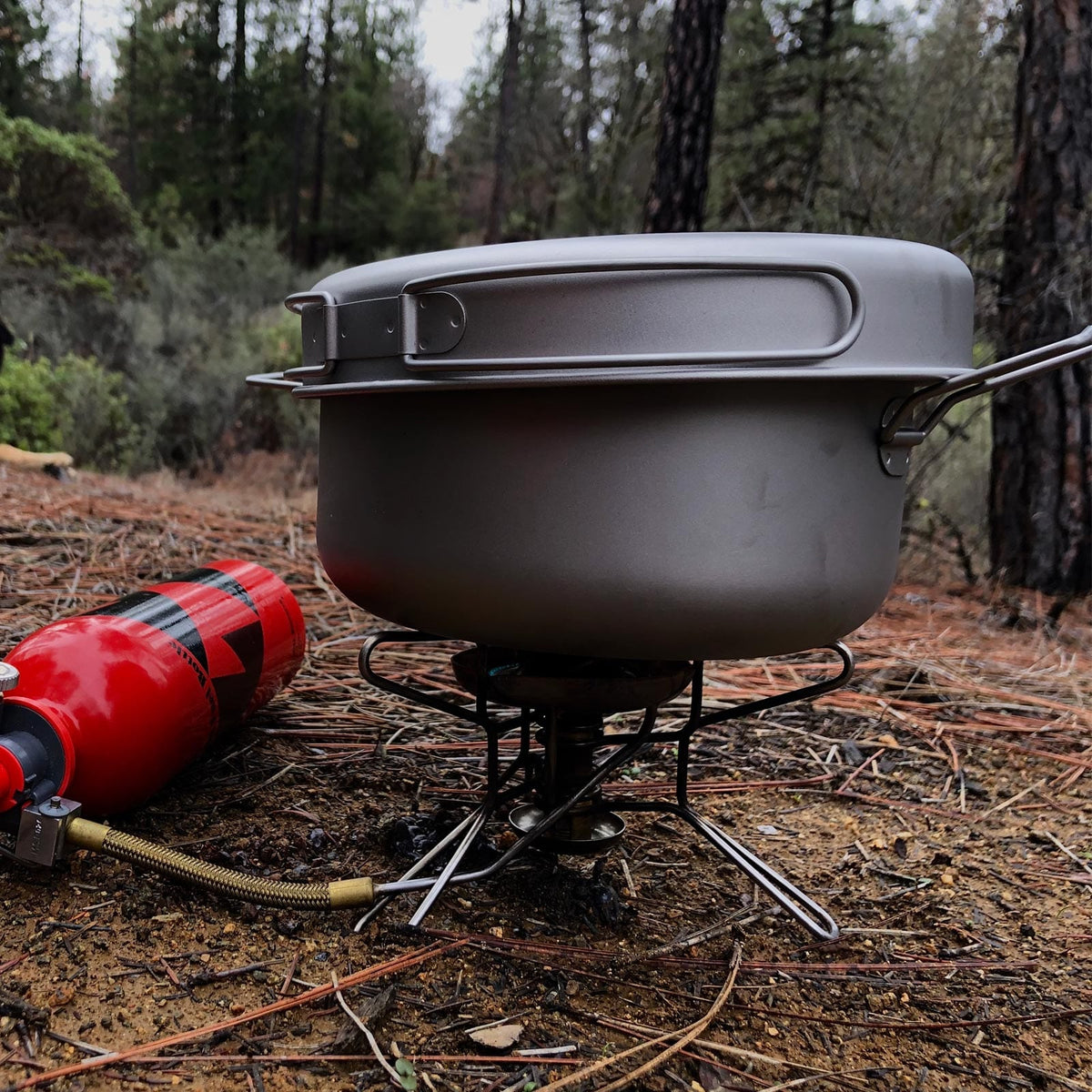 SilverAnt Ultralight Large 2-Piece Titanium Pot & Pan Camping Cookware Set - In-Use (Using the pan as a lid in forest clearing)