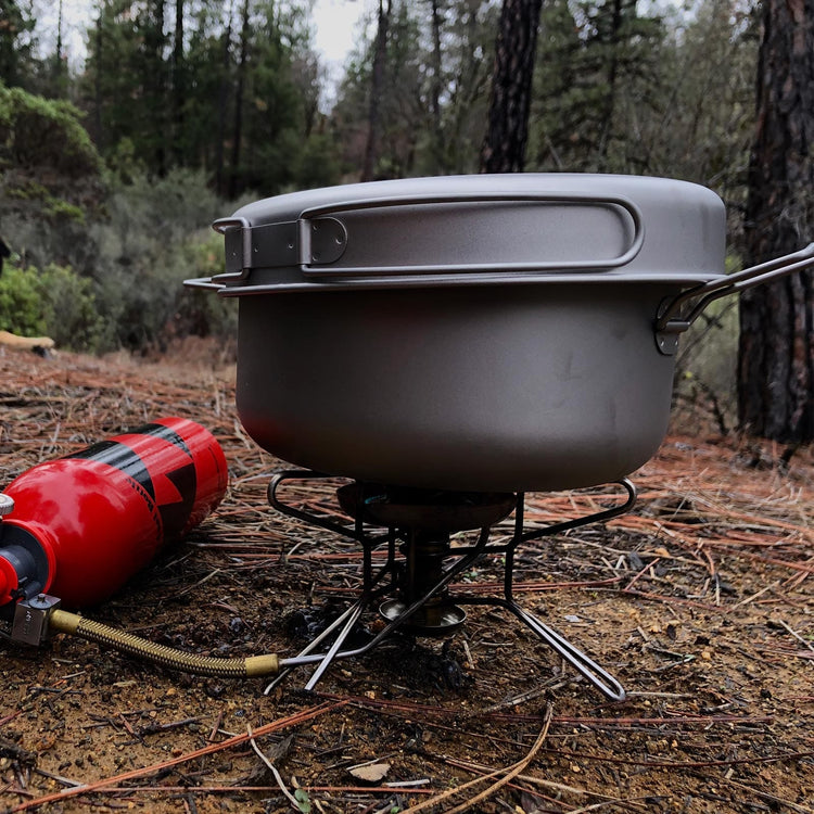 
                  
                    SilverAnt Ultralight Large 2-Piece Titanium Pot & Pan Camping Cookware Set - In-Use (Using the pan as a lid in forest clearing)
                  
                