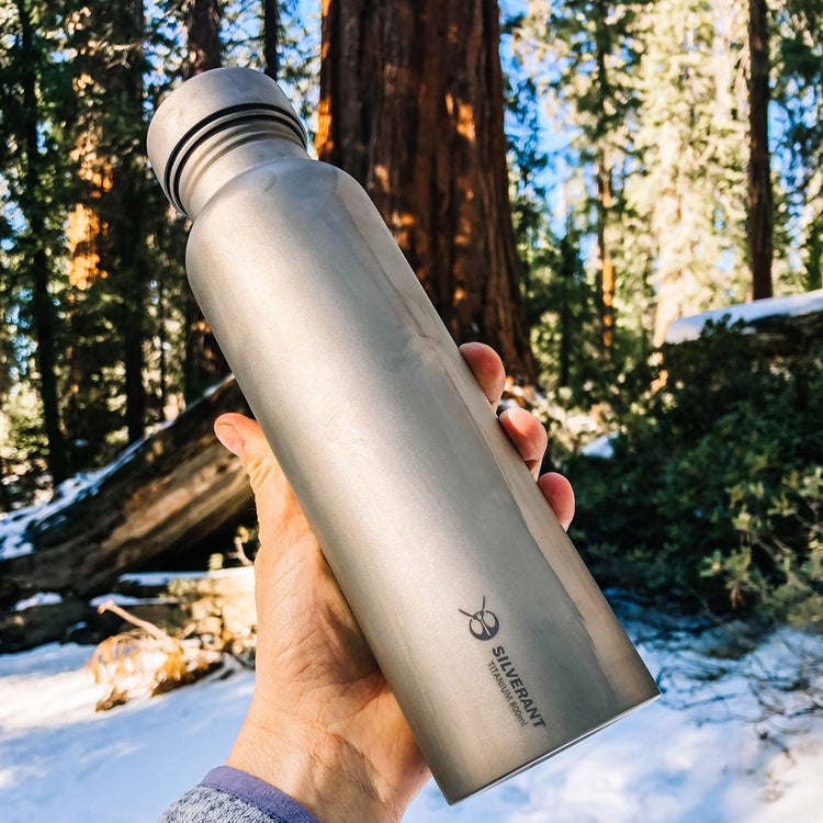 
                  
                    SilverAnt Ultralight Round Titanium Water Bottle - 800ml In-Use (on-hand, actual product photo, winter camping, winter background)
                  
                