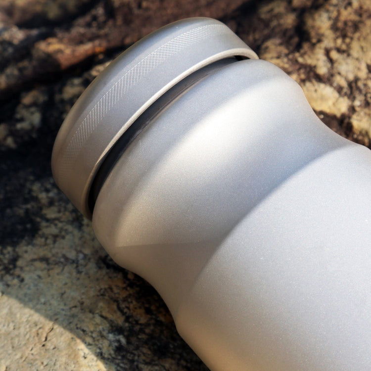 
                  
                    SilverAnt Ultralight Sports Edition Titanium Water Bottle - In-Use (close-up of lid + sandblasted finish, dented ergonomic design, grip texture, actual product photo)
                  
                