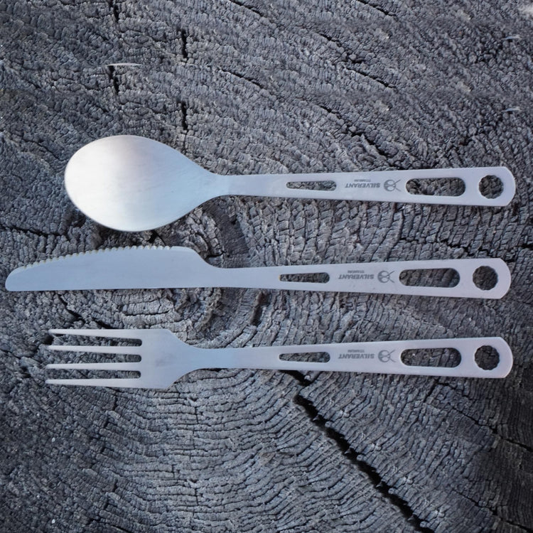 
                  
                    SilverAnt Ultralight Titanium 3-Piece Cutlery Set (Knife, Fork and Spoon) Sandblasted - actual product photo, outdoors photo, lifestyle shot, placed on a tree stump, top angle view
                  
                