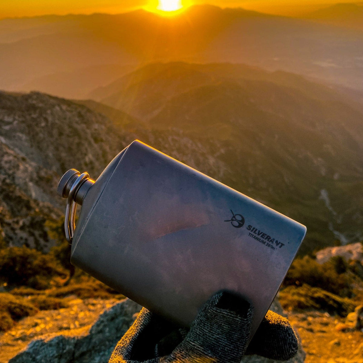 SilverAnt Ultralight Titanium Hip Flask and Funnel 248ml/8.73 fl oz Sandblasted (actual product photo, lifestyle shot, sunset view)