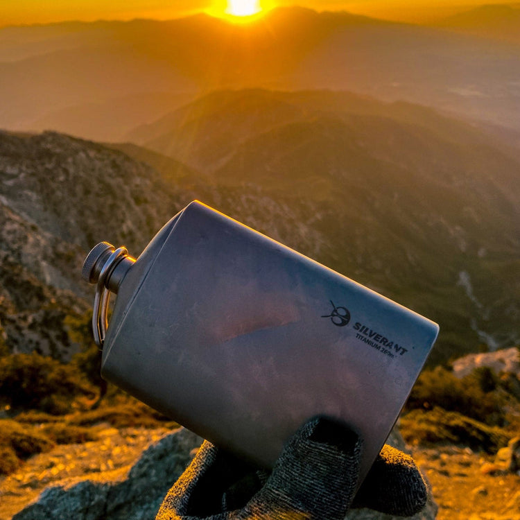 
                  
                    SilverAnt Ultralight Titanium Hip Flask and Funnel 248ml/8.73 fl oz Sandblasted (actual product photo, lifestyle shot, sunset view)
                  
                