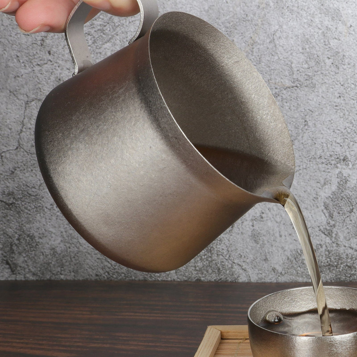 SilverAnt Ultralight Titanium Pour Over Tea Pot 260ml/9.15fl oz Crystallized (Actual product photo, pouring tea onto cup, real life, in use, lifestyle photo)