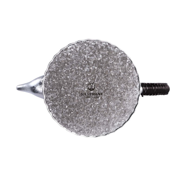
                  
                    SilverAnt Ultralight Titanium Pour Over Tea Pot with Black Braided Handle and Ornate Wooden Lid Handle - Bottom of tea pot showing SilverAnt branding
                  
                