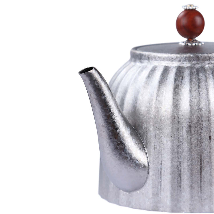 
                  
                    SilverAnt Ultralight Titanium Pour Over Tea Pot with Black Braided Handle and Ornate Wooden Lid Handle (close-up of spout)
                  
                