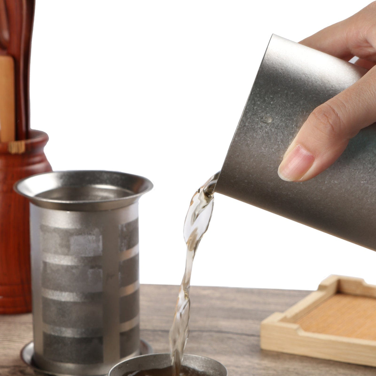 SilverAnt Ultralight Titanium Tea Pour Over Filter 350ml/12.3 fl oz (actual product photo, in-use, pouring tea out)