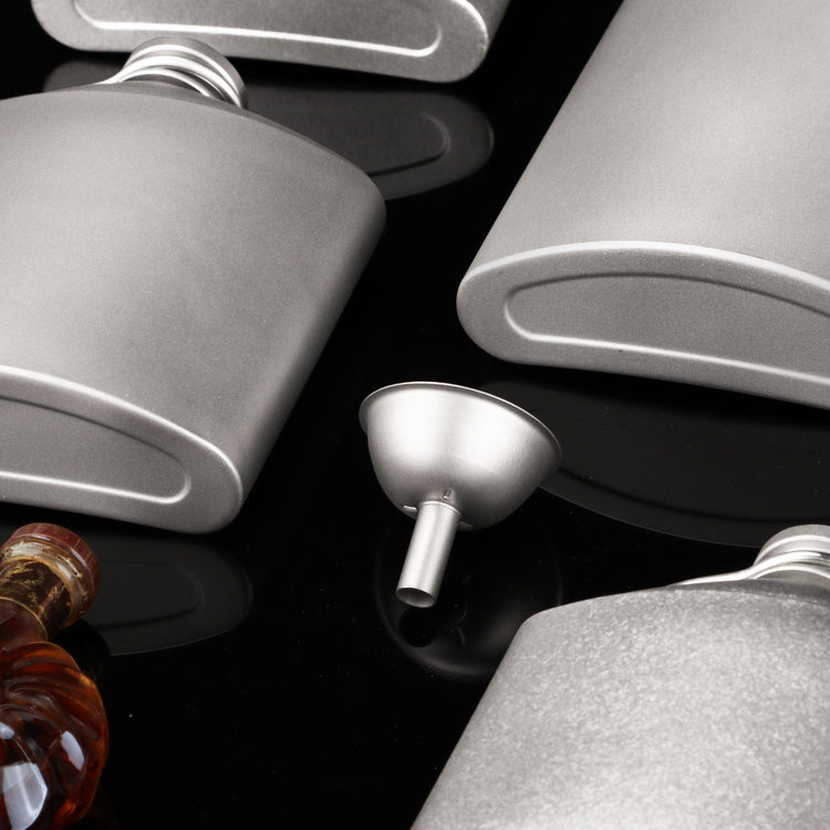
                  
                    Titanium Hip Flask Funnel creative shot, surrounded by hip flask various sizes
                  
                